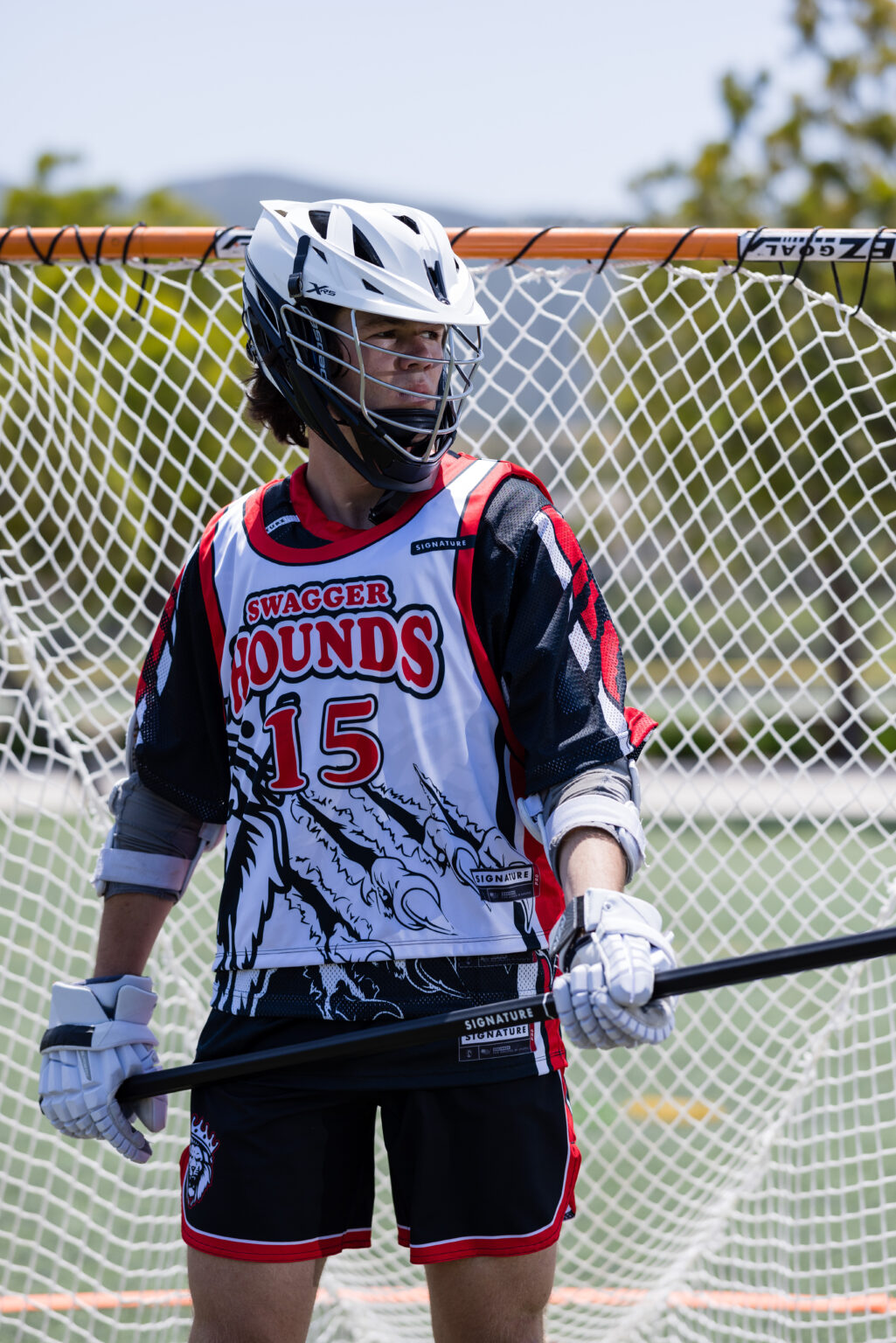 A young lacrosse player in Signature gear.